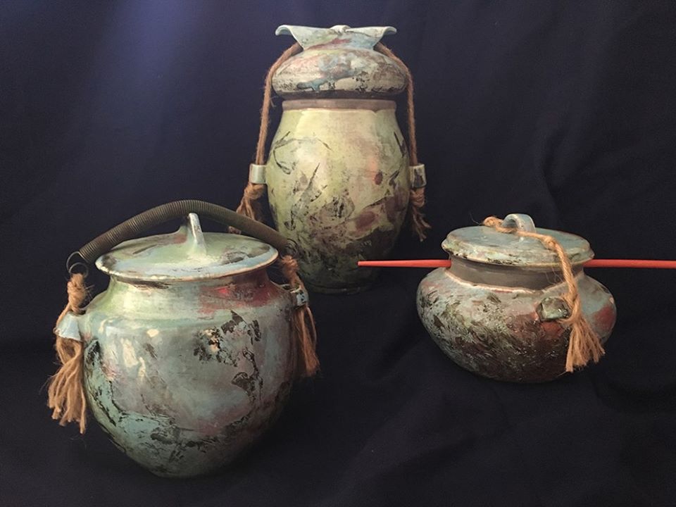 three turquoise raku fired pots with various lid hardware